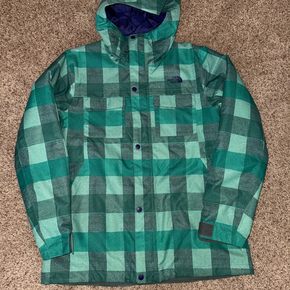 The North Face Green Checkered Ski Jacket with navy blue lining.